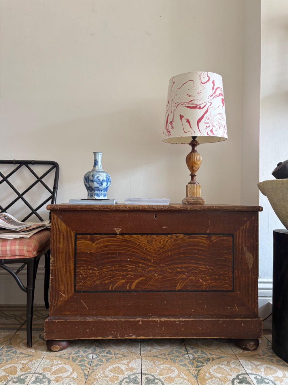 A 19th-century rectangular pine trunk featuring decorative scumble glazed painted panels, a hinged lid, and turned bun feet. View III