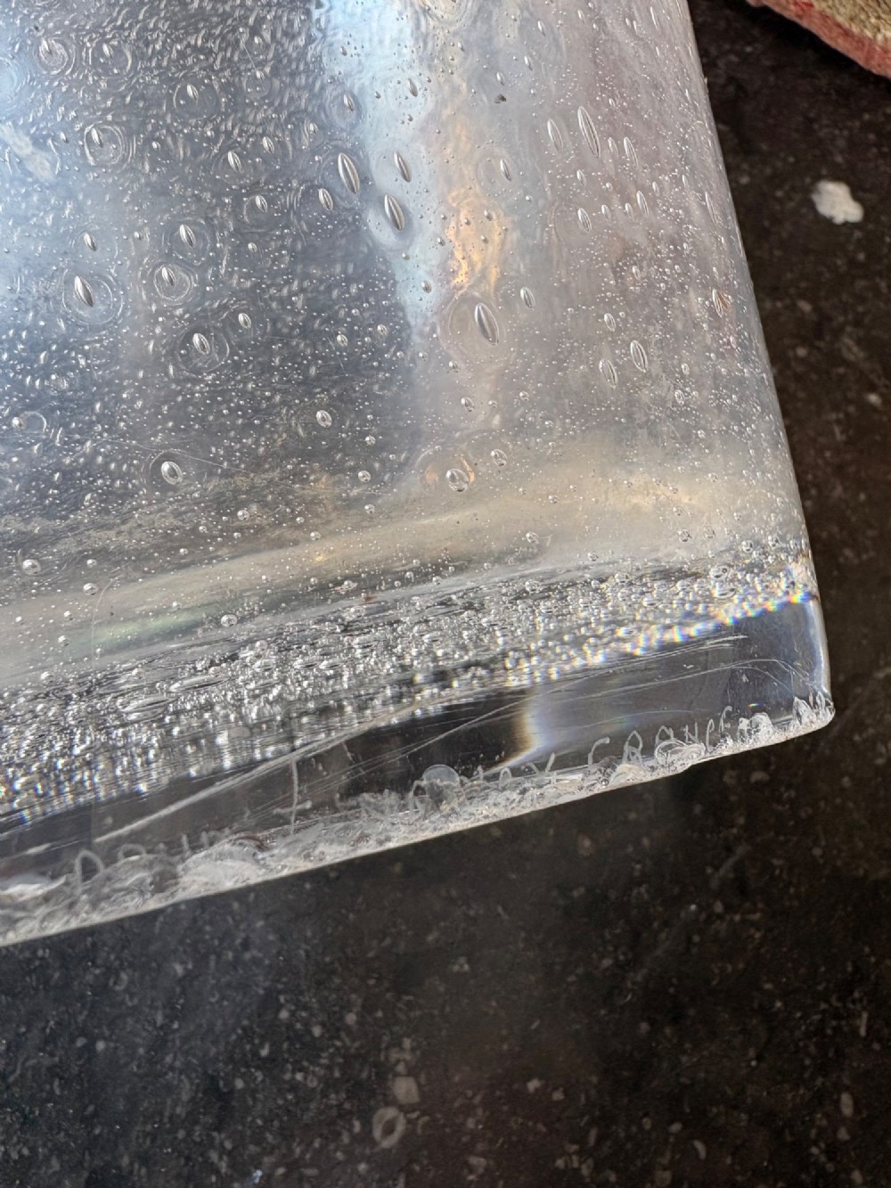 A tall flared Art Deco clear crystal vase featuring a densely bubble-textured interior. View II
