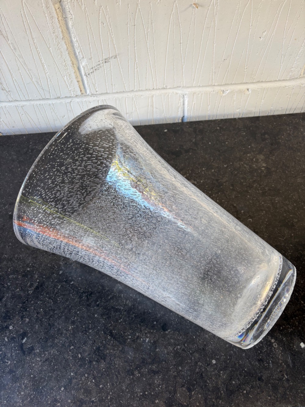 A tall flared Art Deco clear crystal vase featuring a densely bubble-textured interior. View VI