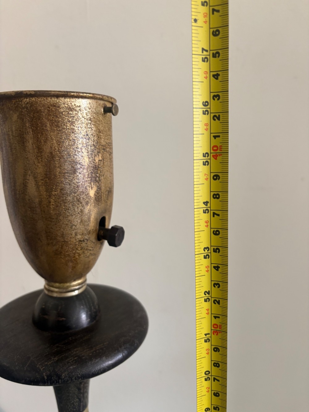 A French 1920s ebonised floor lamp featuring a carved barley twist column on a square base with a brass socket fitting. View XIII