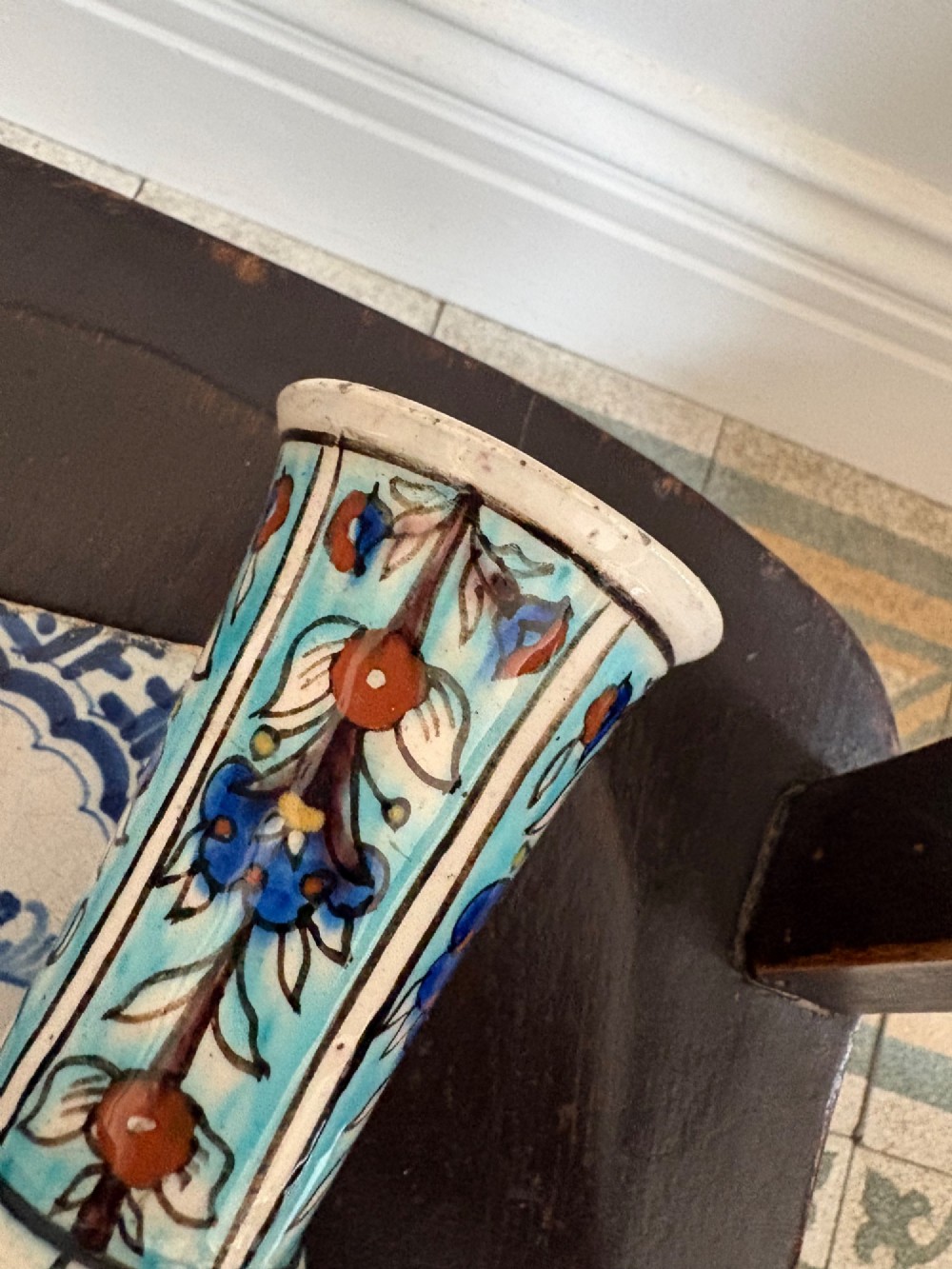 A hand-painted 19th-century Iznik style fritware bottle vase decorated with turquoise, cobalt blue, and red floral arabesque motifs. View VII