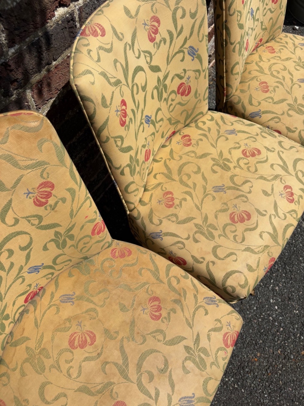 A row of 1930s Art Deco dining chairs featuring yellow floral pattern upholstery and dark oak tapered legs. View XI