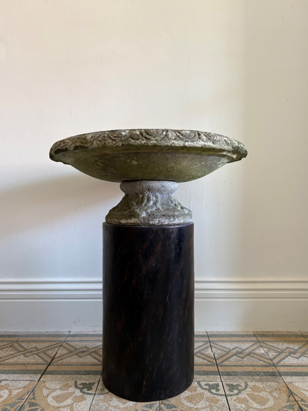 A shallow Neoclassical cast stone birdbath planter with a low moulded pedestal base, displaying a weathered grey and green patinated surface. View III