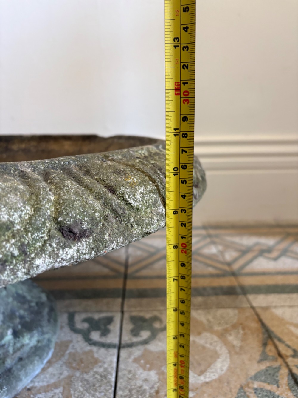 A shallow Neoclassical cast stone birdbath planter with a low moulded pedestal base, displaying a weathered grey and green patinated surface. View XIV
