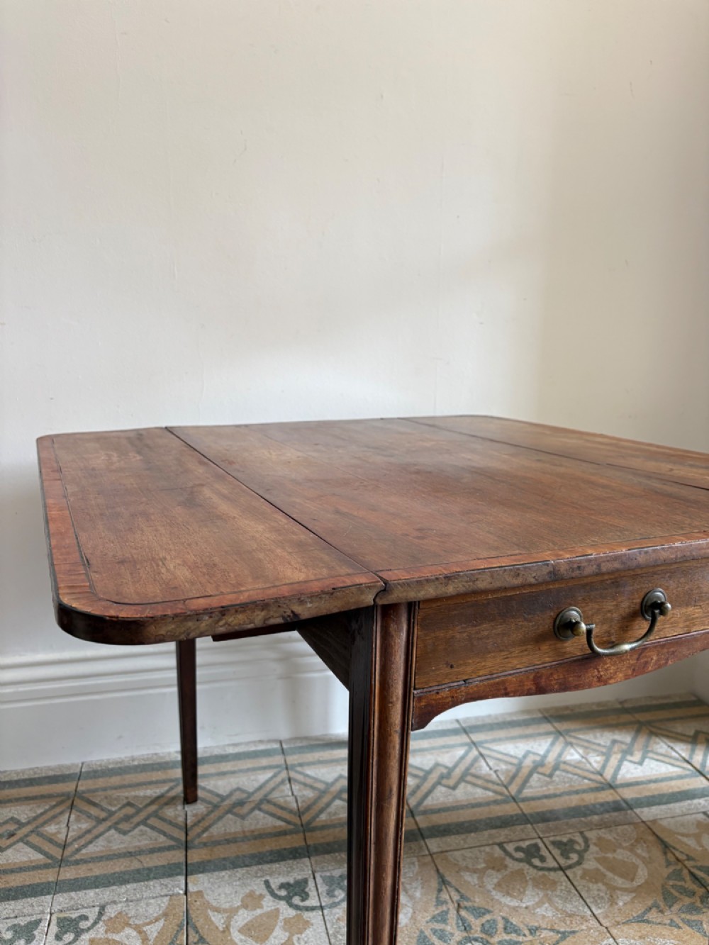 A Georgian mahogany drop-leaf Pembroke table featuring a shaped apron and tapered square legs. View IV