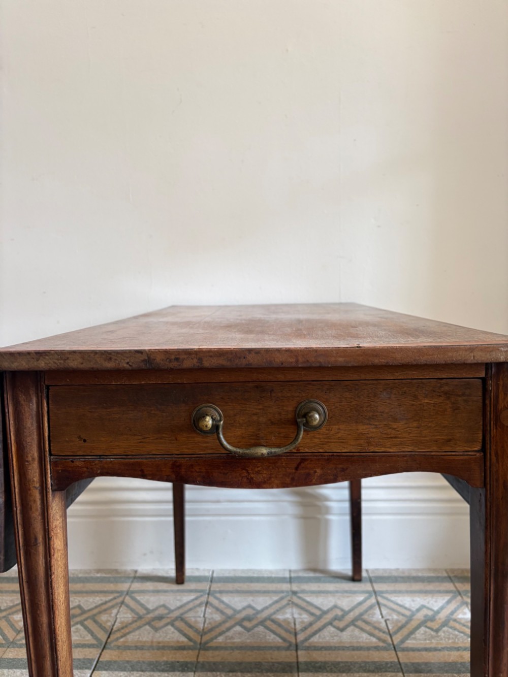 A Georgian mahogany drop-leaf Pembroke table featuring a shaped apron and tapered square legs. View VIII