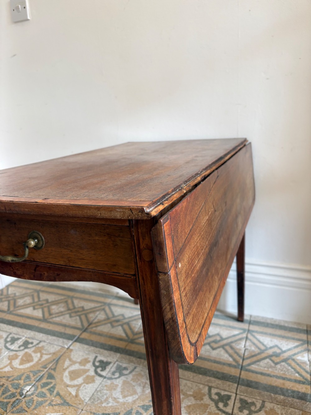 A Georgian mahogany drop-leaf Pembroke table featuring a shaped apron and tapered square legs. View XI