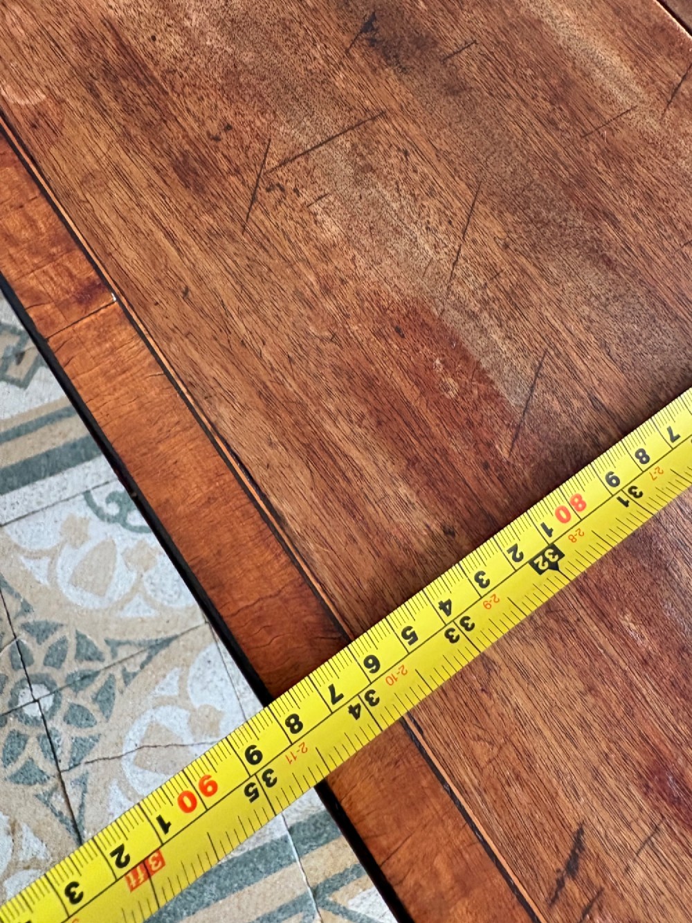 A Georgian mahogany drop-leaf Pembroke table featuring a shaped apron and tapered square legs. View XII