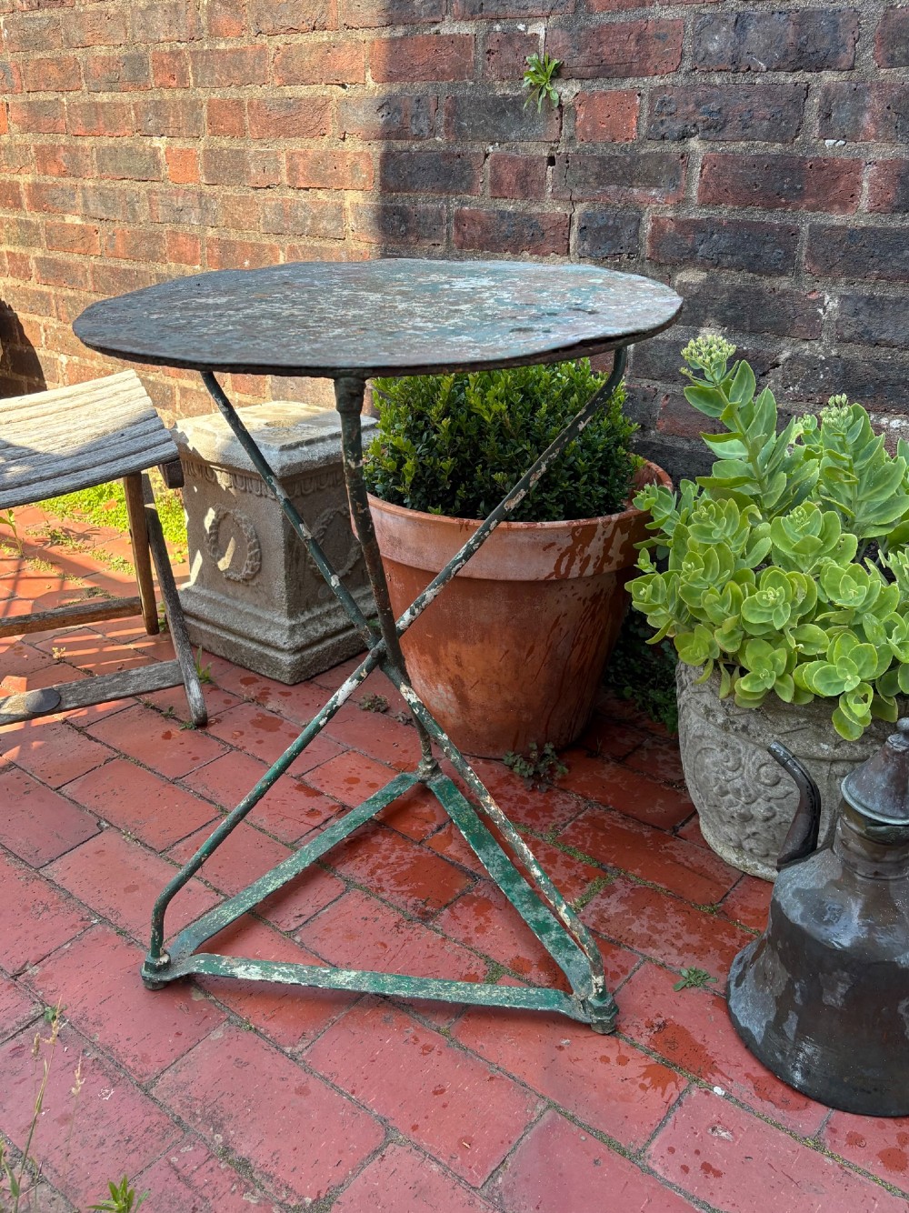 A 19th-century French cast iron gueridon round table featuring distressed green paint and a triangular tripod base. View XI