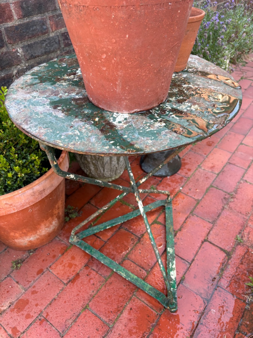 A 19th-century French cast iron gueridon round table featuring distressed green paint and a triangular tripod base. View XIV