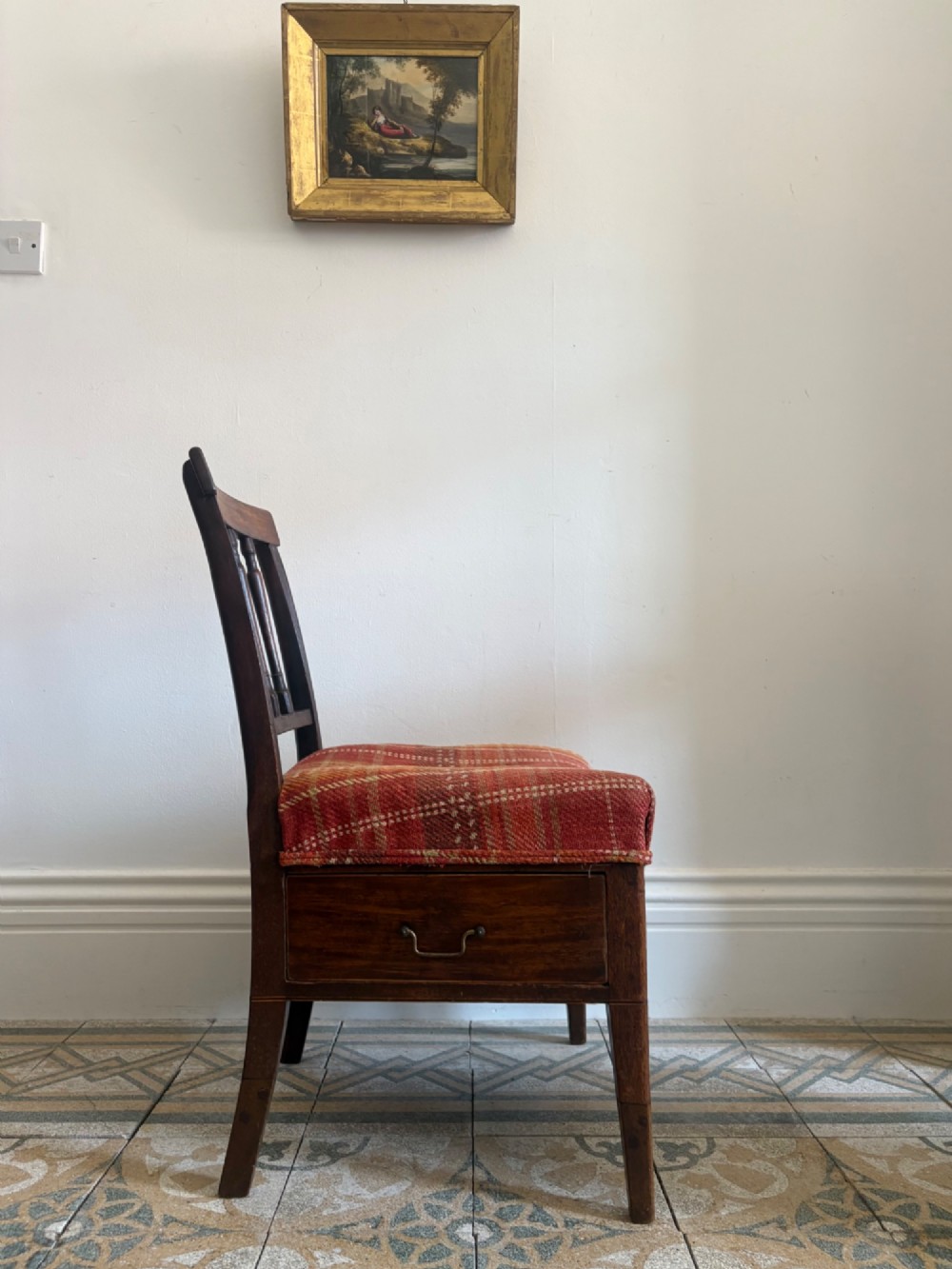 A Regency mahogany and beech side chair featuring a red plaid upholstered seat above an integrated wooden drawer with a brass drop handle. View II