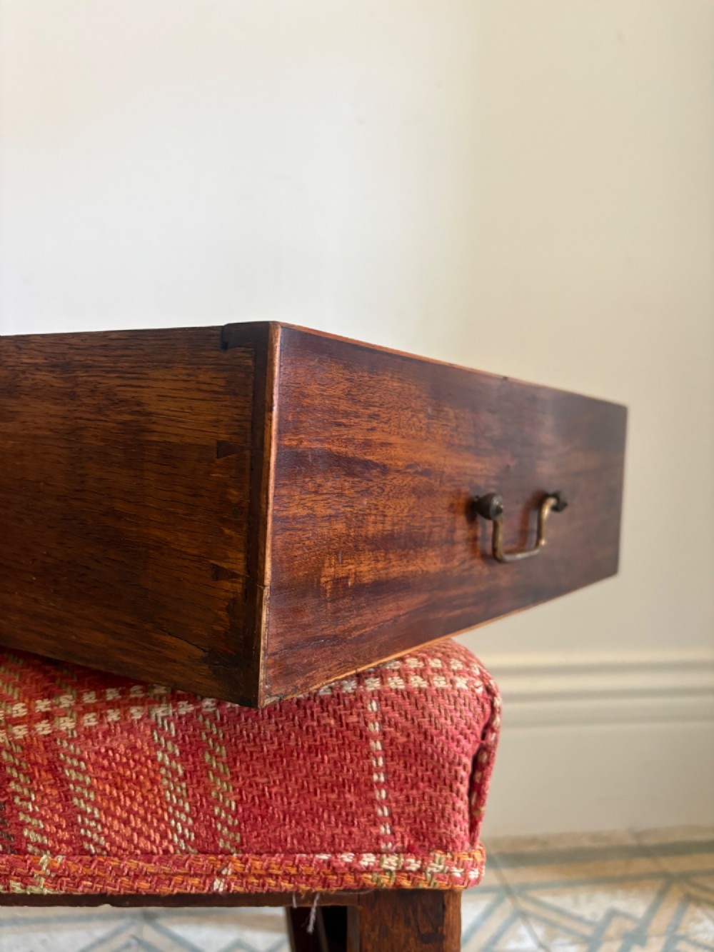A Regency mahogany and beech side chair featuring a red plaid upholstered seat above an integrated wooden drawer with a brass drop handle. View IV