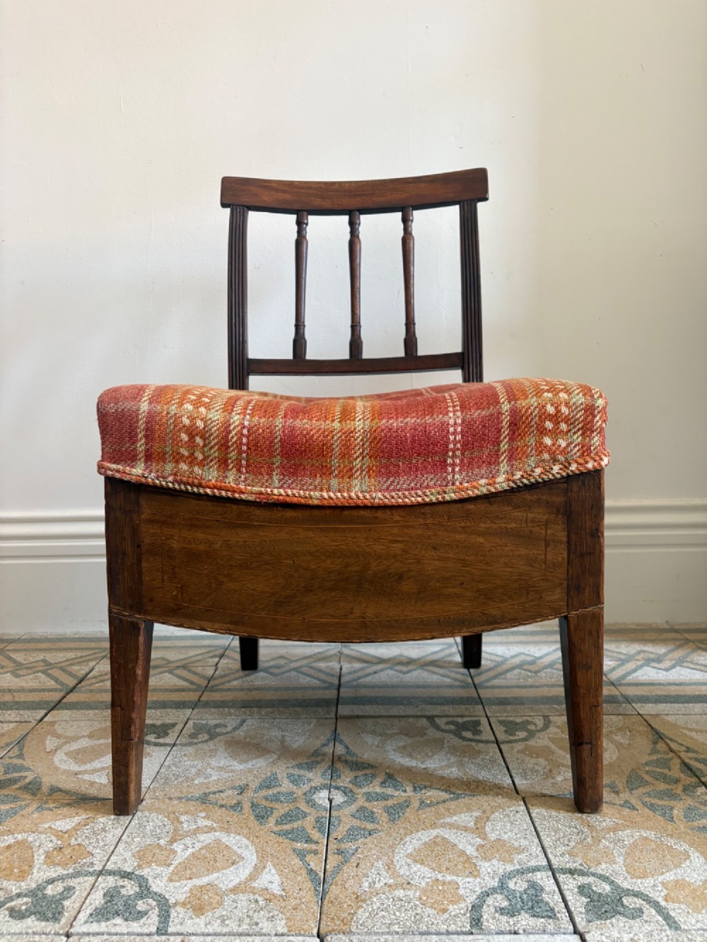A Regency mahogany and beech side chair featuring a red plaid upholstered seat above an integrated wooden drawer with a brass drop handle. View V