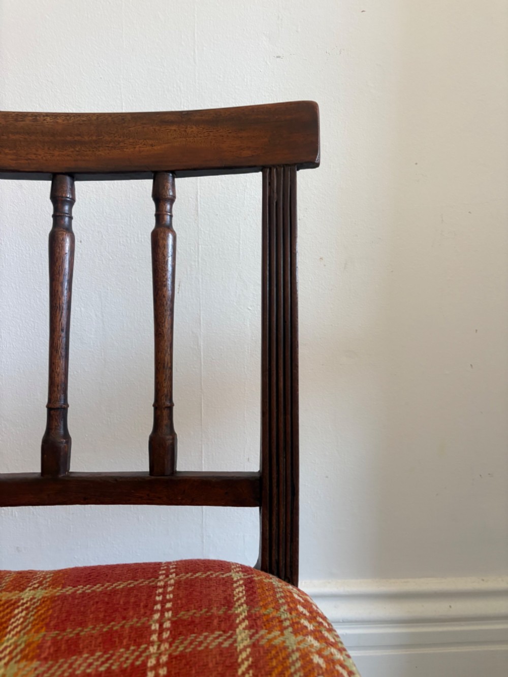 A Regency mahogany and beech side chair featuring a red plaid upholstered seat above an integrated wooden drawer with a brass drop handle. View IX