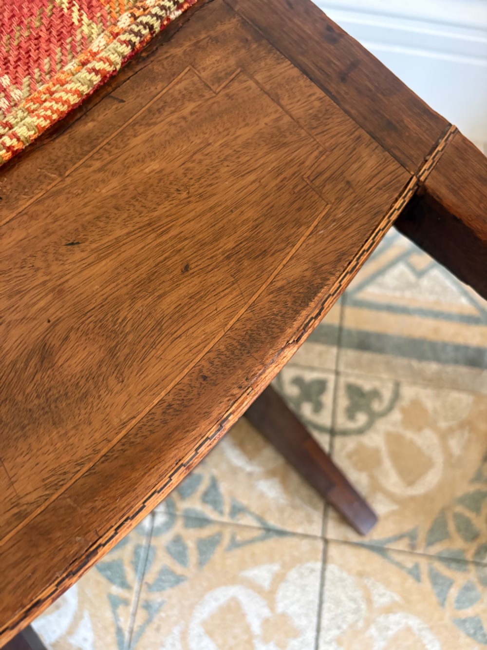 A Regency mahogany and beech side chair featuring a red plaid upholstered seat above an integrated wooden drawer with a brass drop handle. View XII