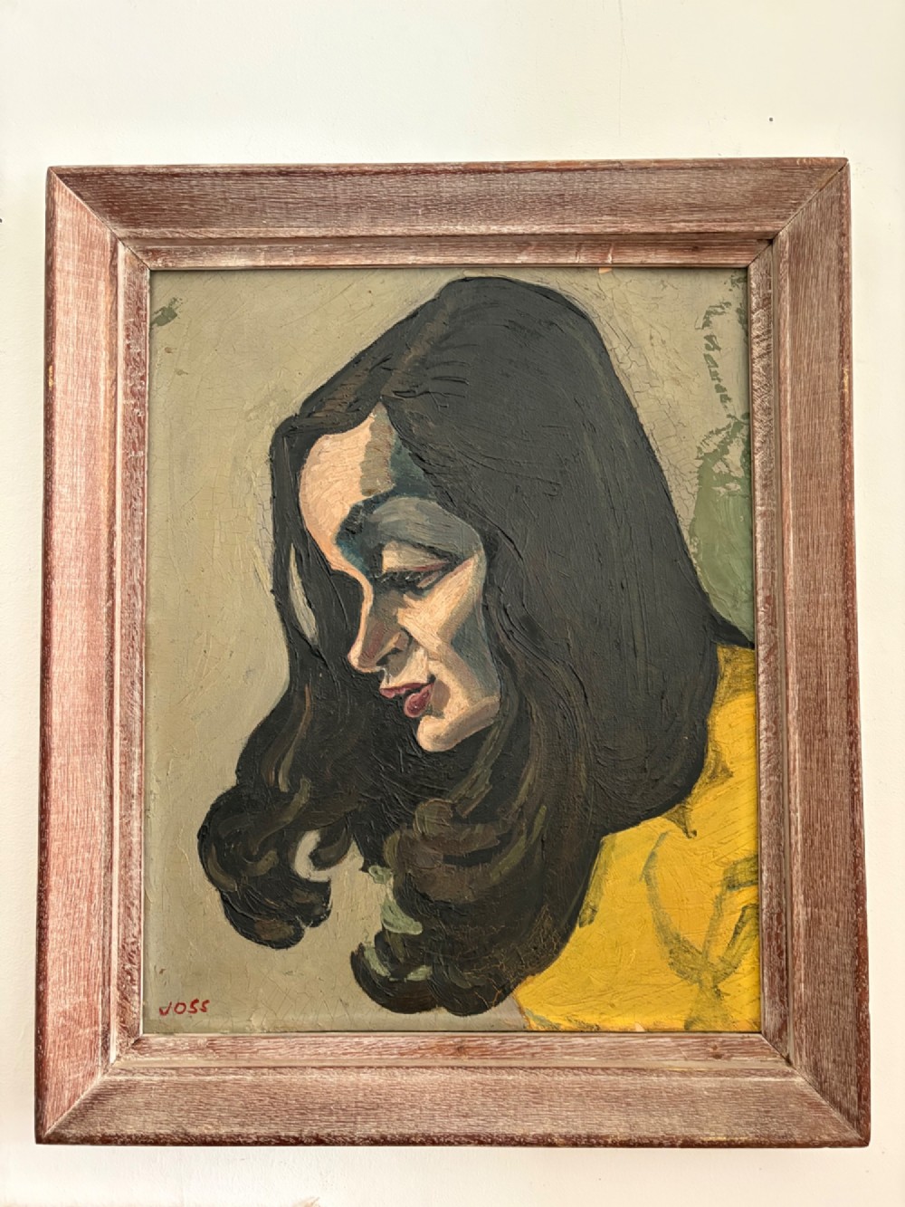 A framed 1930s German Expressionist oil painting on panel depicting a dark-haired woman in profile wearing a yellow top.