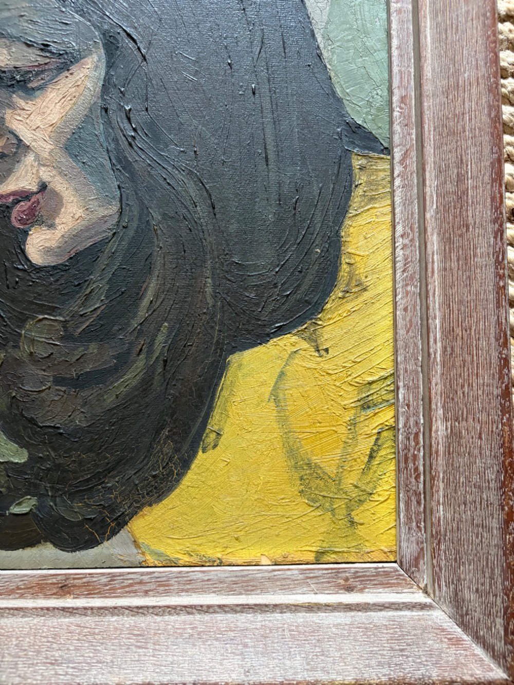 A framed 1930s German Expressionist oil painting on panel depicting a dark-haired woman in profile wearing a yellow top. View IV