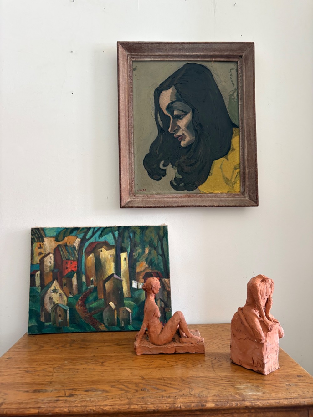A framed 1930s German Expressionist oil painting on panel depicting a dark-haired woman in profile wearing a yellow top. View XI