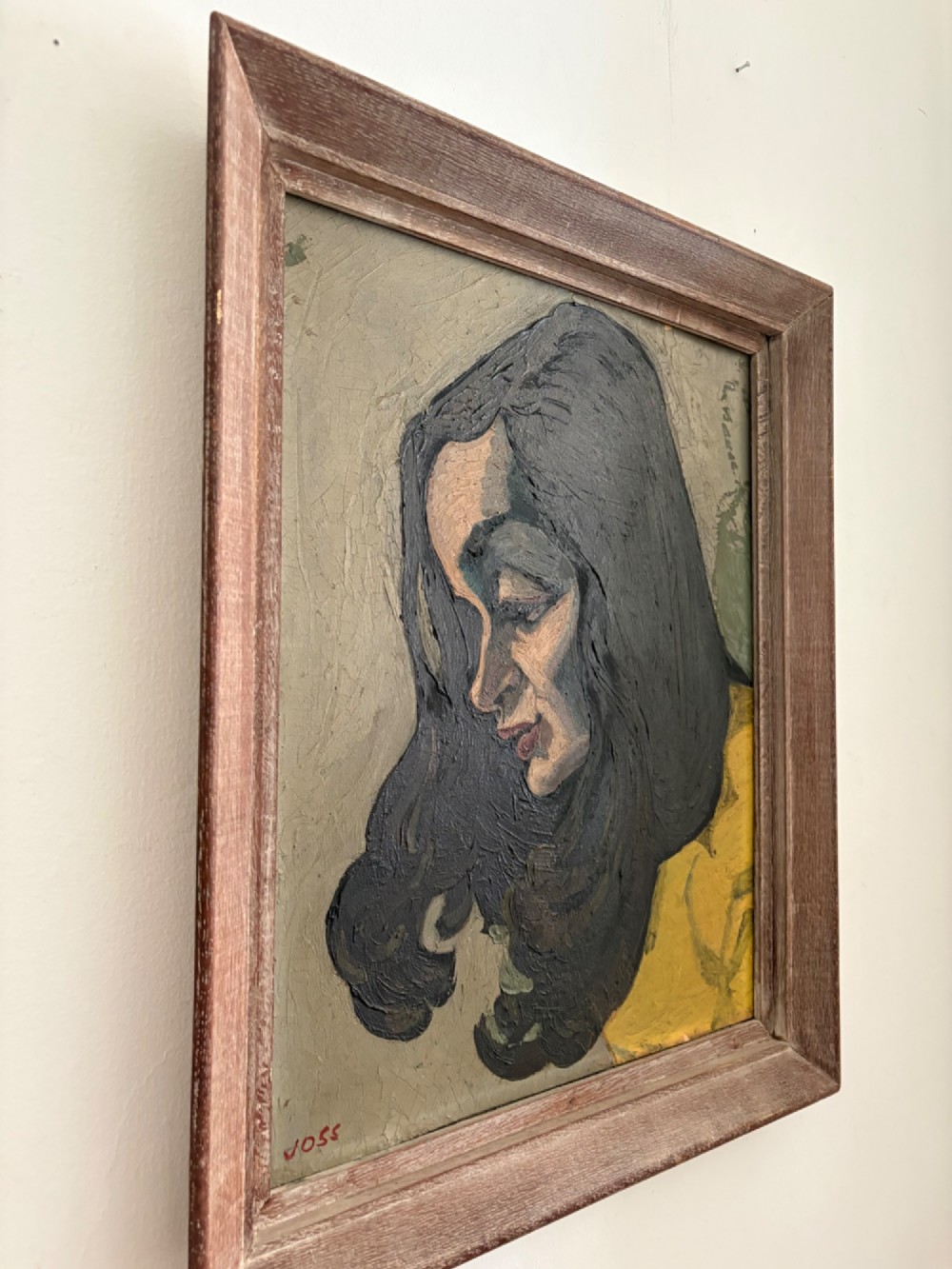 A framed 1930s German Expressionist oil painting on panel depicting a dark-haired woman in profile wearing a yellow top. View XII