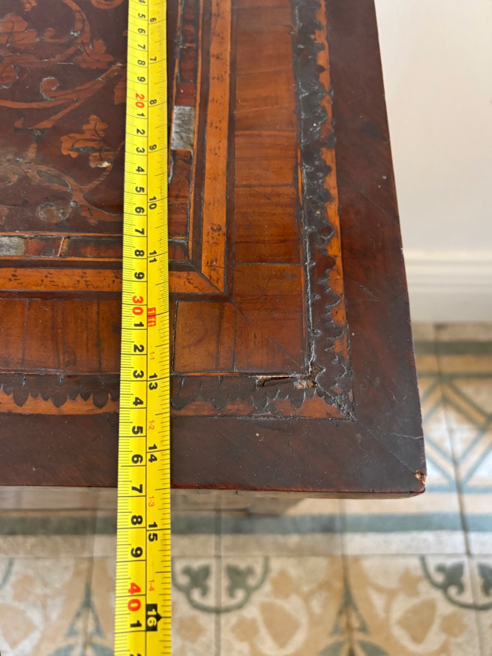 An 18th-century Italian Neoclassical walnut bedside cabinet featuring a central circular figurative marquetry panel on the front door, supported by square tapered legs. View XII