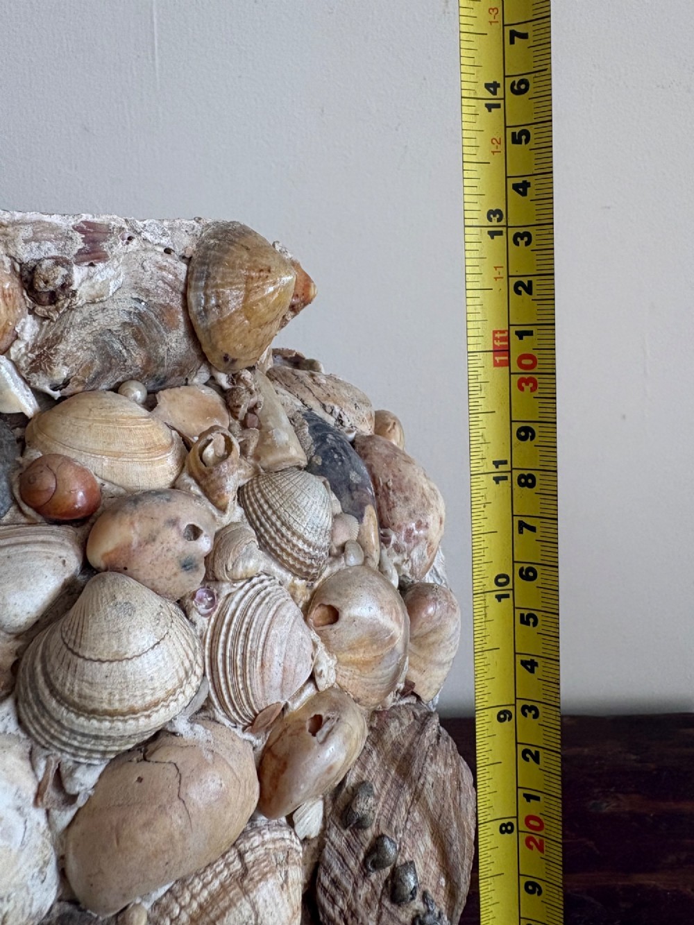 A cylindrical antique vase completely encrusted with an assortment of natural sea shells set into a mortar matrix. View XIV