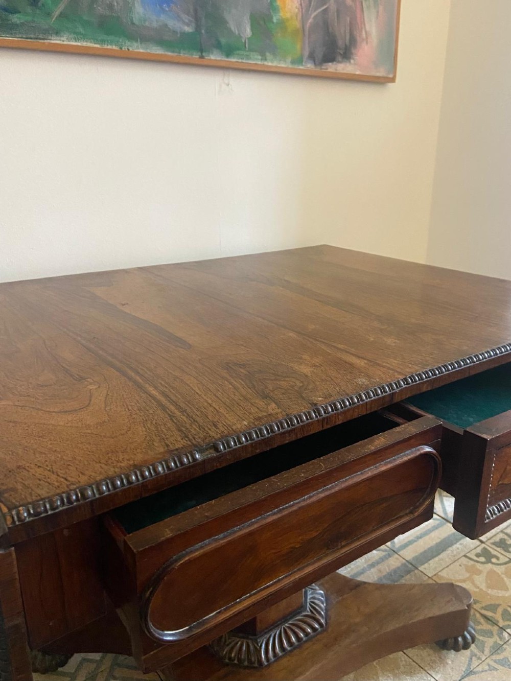 A Regency rosewood sofa table featuring two drop leaves, twin frieze drawers, a central pedestal column, and a quadform base with claw feet. View IX