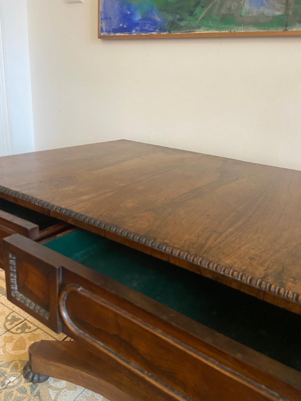 A Regency rosewood sofa table featuring two drop leaves, twin frieze drawers, a central pedestal column, and a quadform base with claw feet. View X