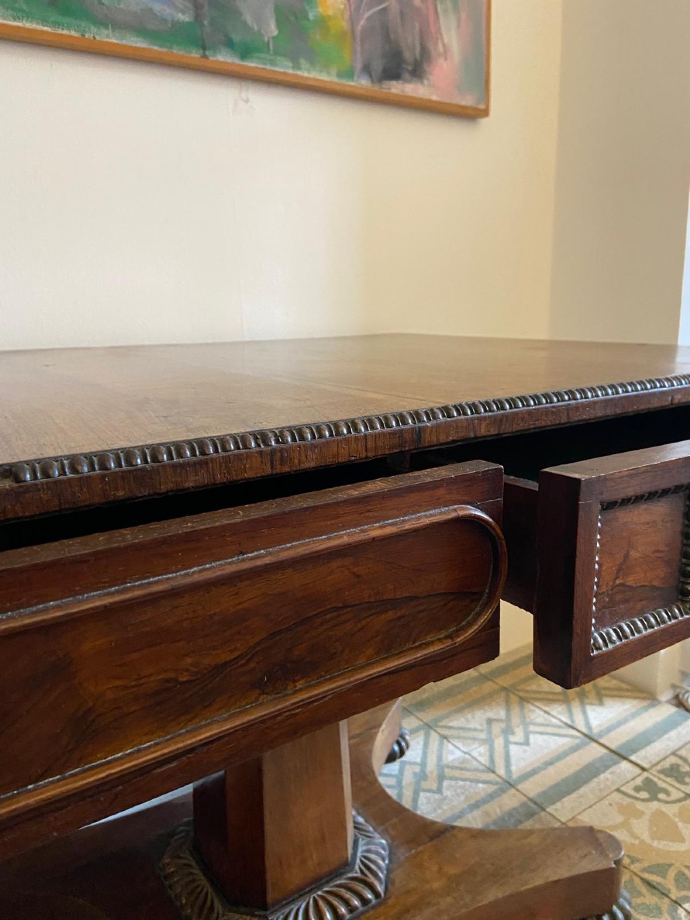 A Regency rosewood sofa table featuring two drop leaves, twin frieze drawers, a central pedestal column, and a quadform base with claw feet. View XI