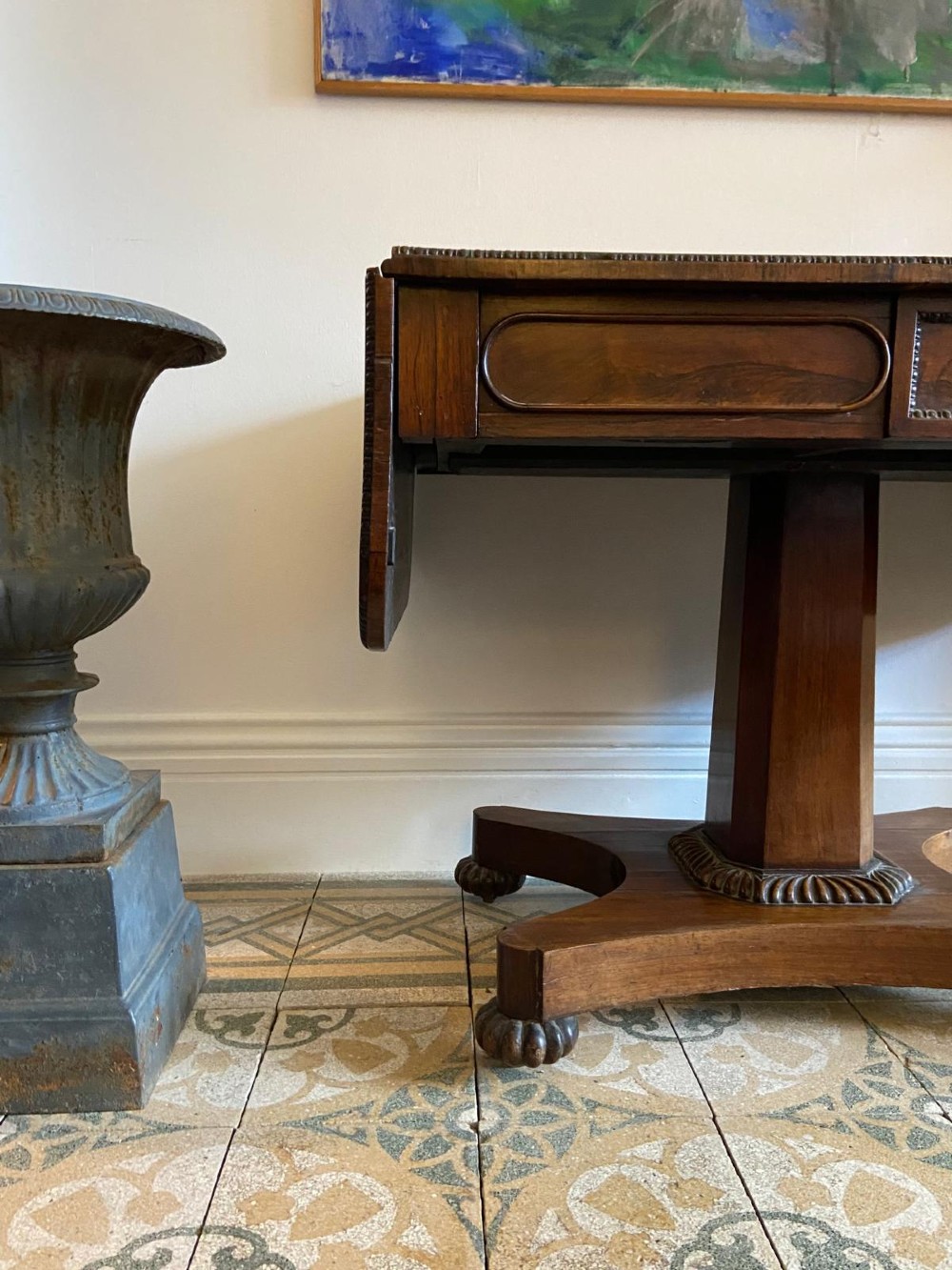 A Regency rosewood sofa table featuring two drop leaves, twin frieze drawers, a central pedestal column, and a quadform base with claw feet. View XII