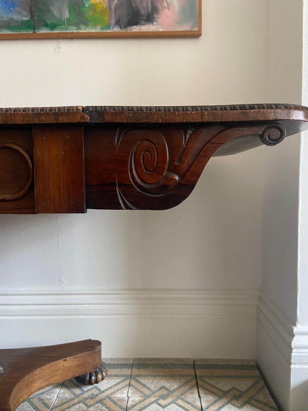 A Regency rosewood sofa table featuring two drop leaves, twin frieze drawers, a central pedestal column, and a quadform base with claw feet. View XV