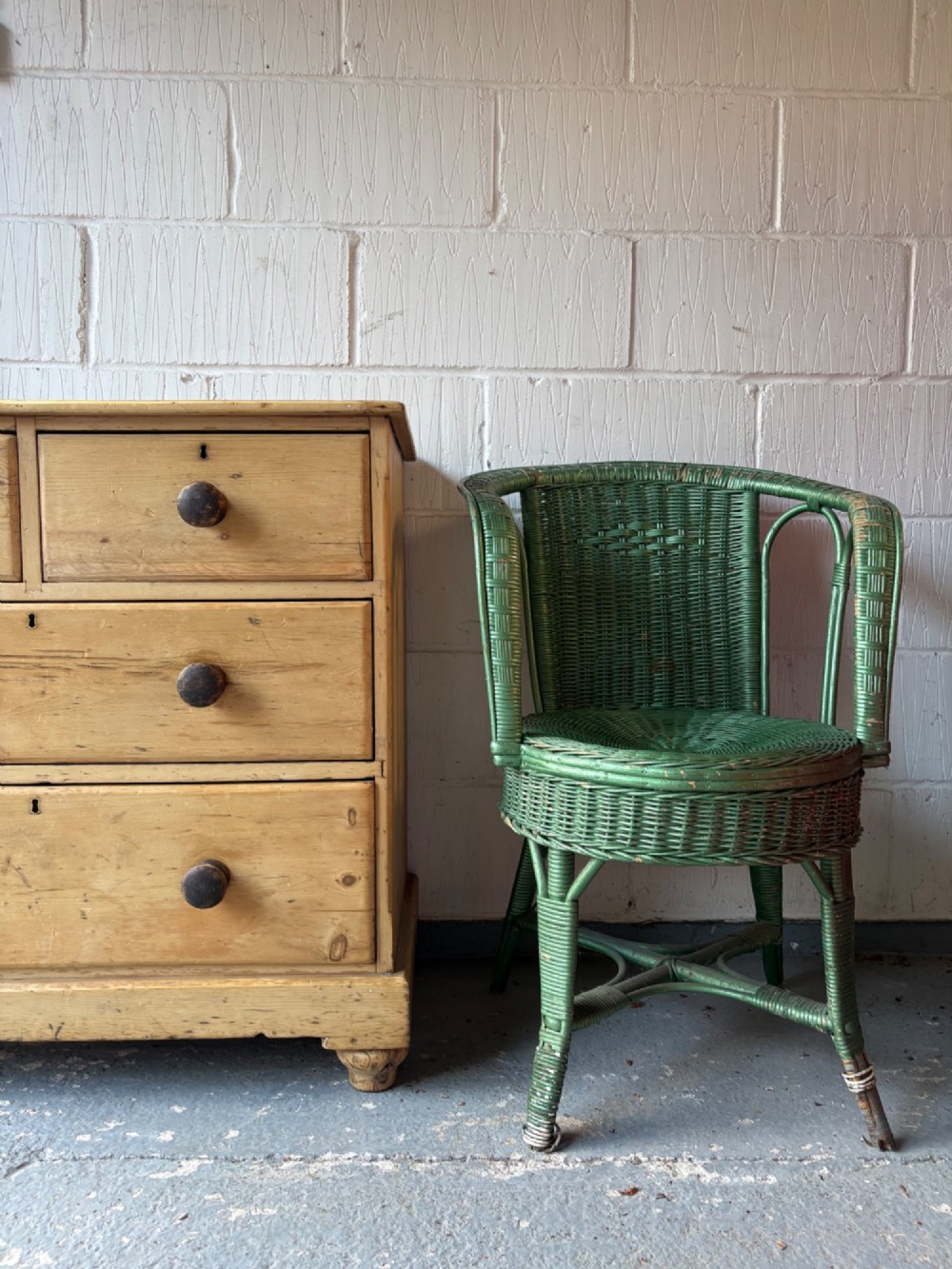A nineteenth-century scrubbed pine chest of drawers with two small drawers above two long drawers featuring dark turned bun handles. View XII