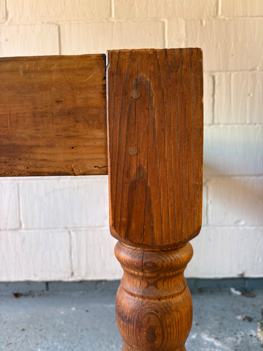 An Edwardian rectangular pine farmhouse kitchen table featuring turned elm legs and a thick wooden top. View VII