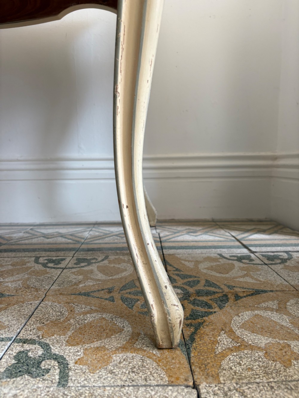 A cream painted French console table featuring long cabriole legs, a shaped apron with subtle trim, and an inset suede tabletop. View III