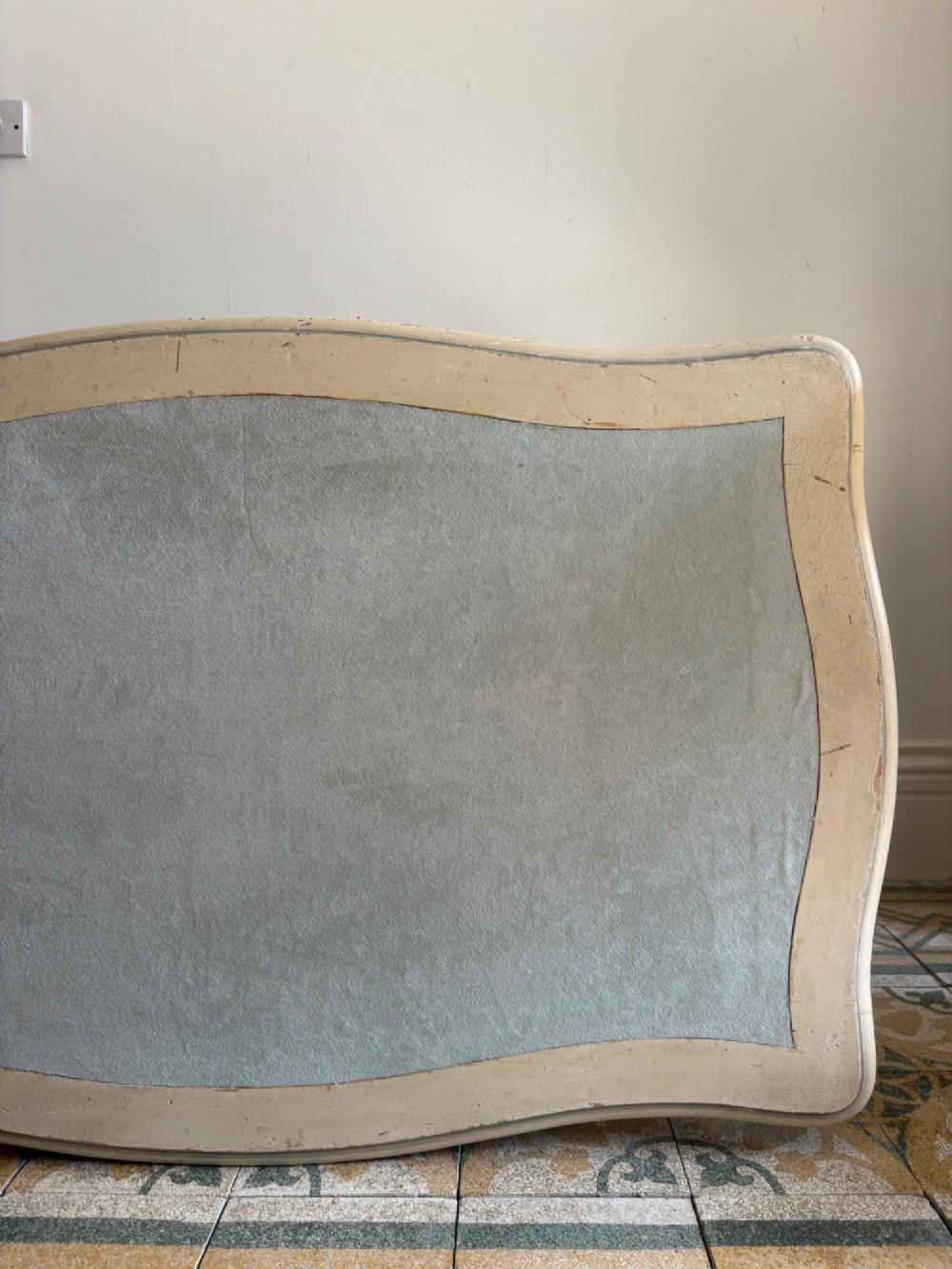 A cream painted French console table featuring long cabriole legs, a shaped apron with subtle trim, and an inset suede tabletop. View VIII