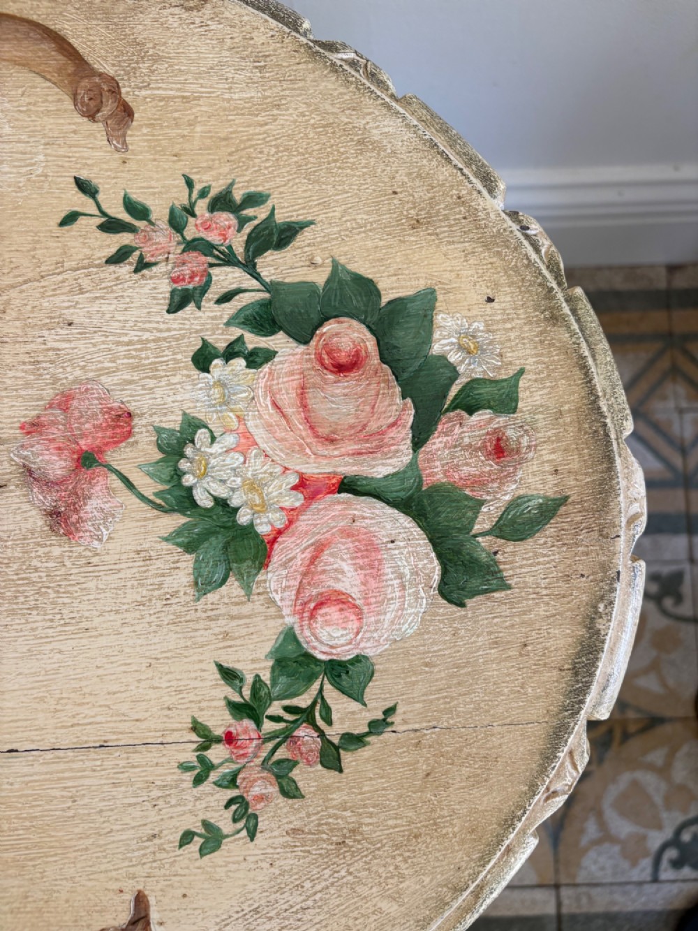 An oval cream-painted mahogany occasional table with hand-painted floral garlands, fluted apron, and square tapered fluted legs. View IX