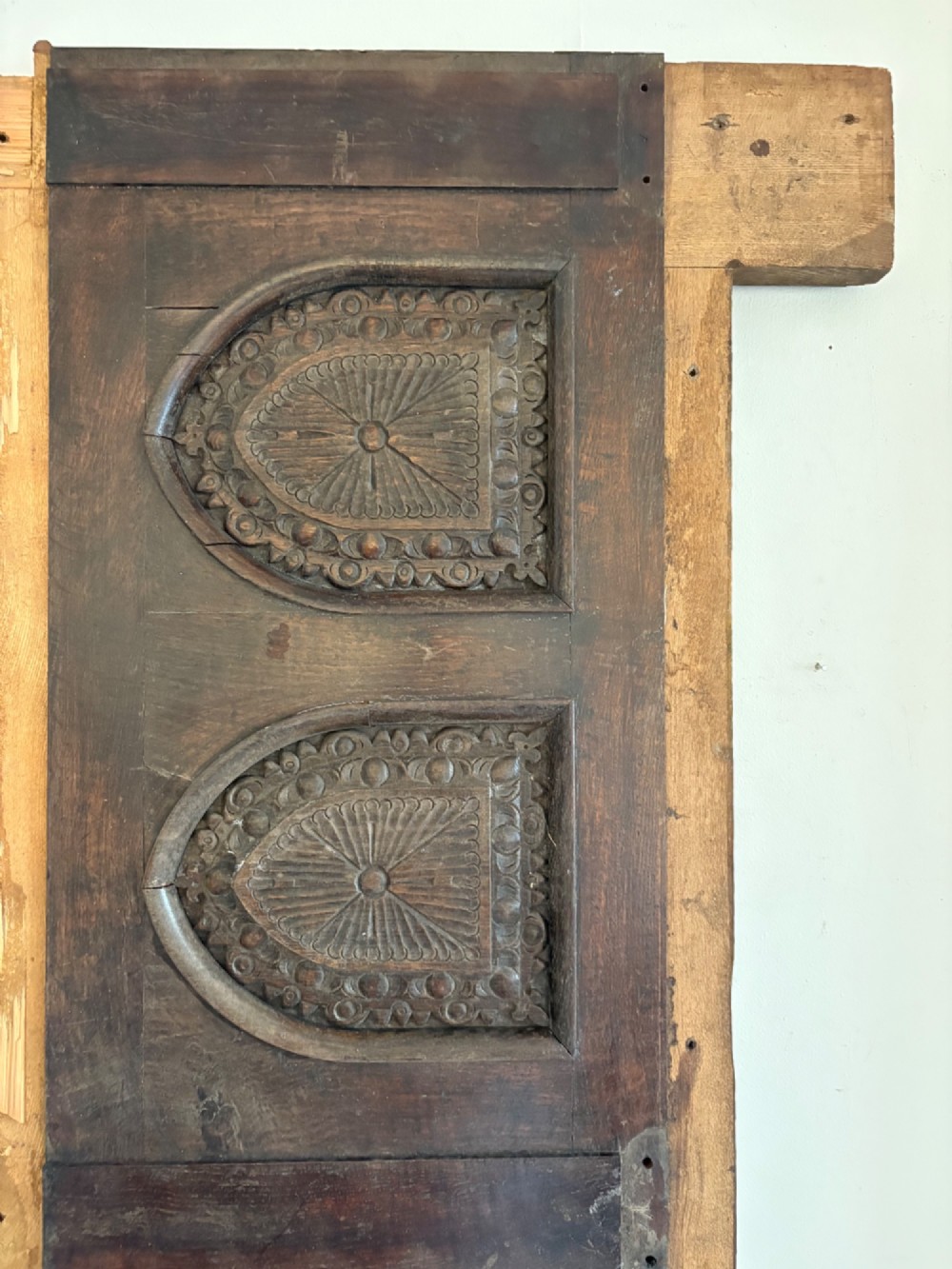 A tall nineteenth-century dark oak architectural panel featuring six vertically arranged carved gothic arches with fan motifs. View IX