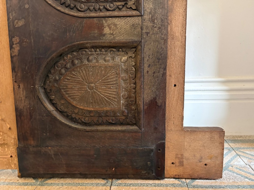 A tall nineteenth-century dark oak architectural panel featuring six vertically arranged carved gothic arches with fan motifs. View XI