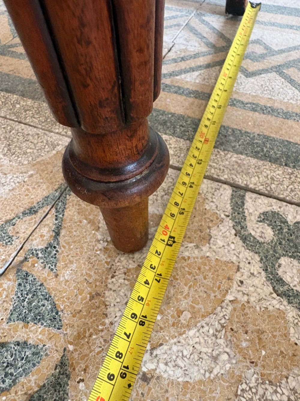 An antique William IV mahogany hall chair featuring a carved crest backrest, solid flat seat, and fluted turned front legs. View XV