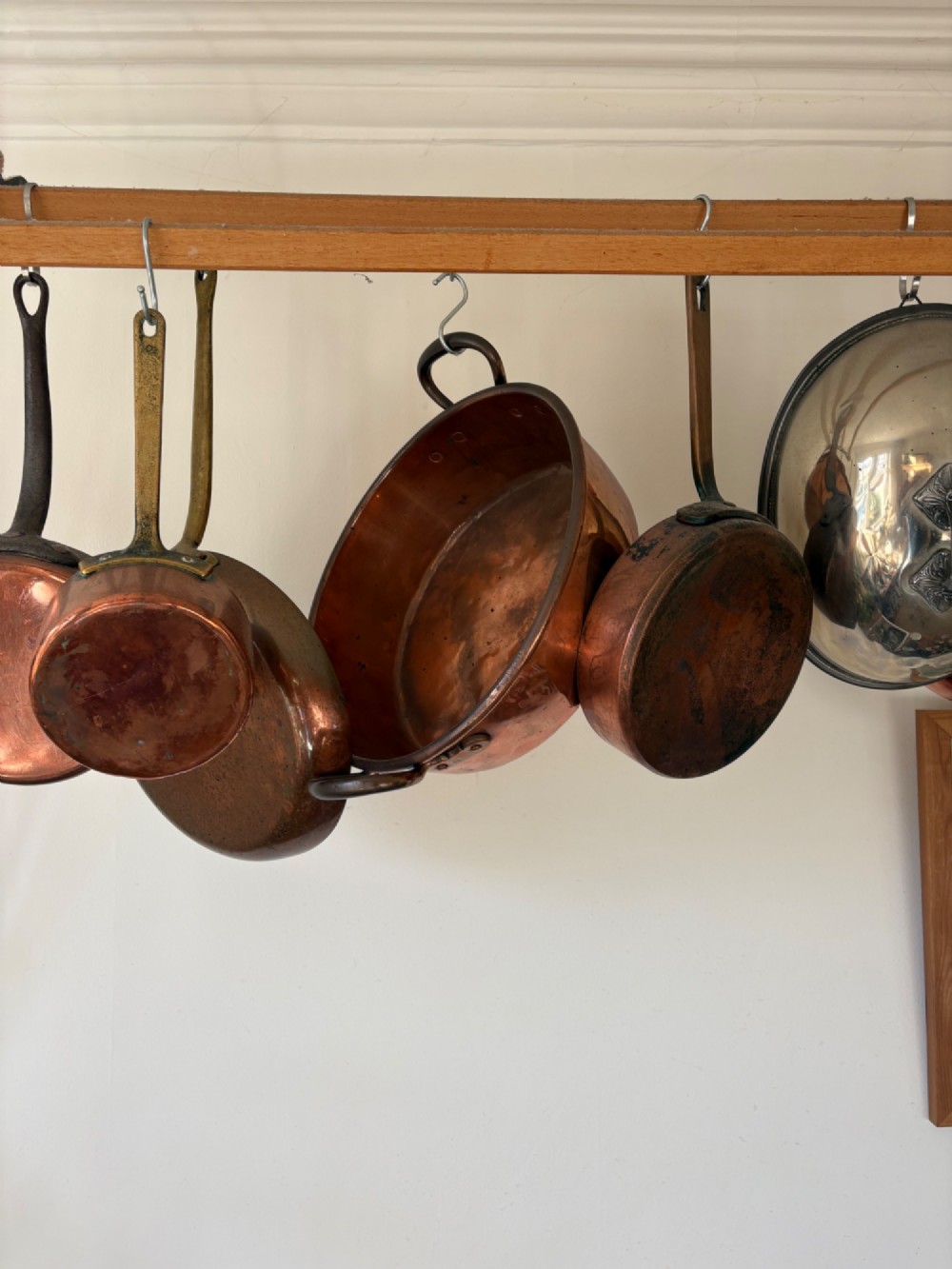 A large 19th-century polished copper preserve pan featuring twin riveted brass handles. View XII