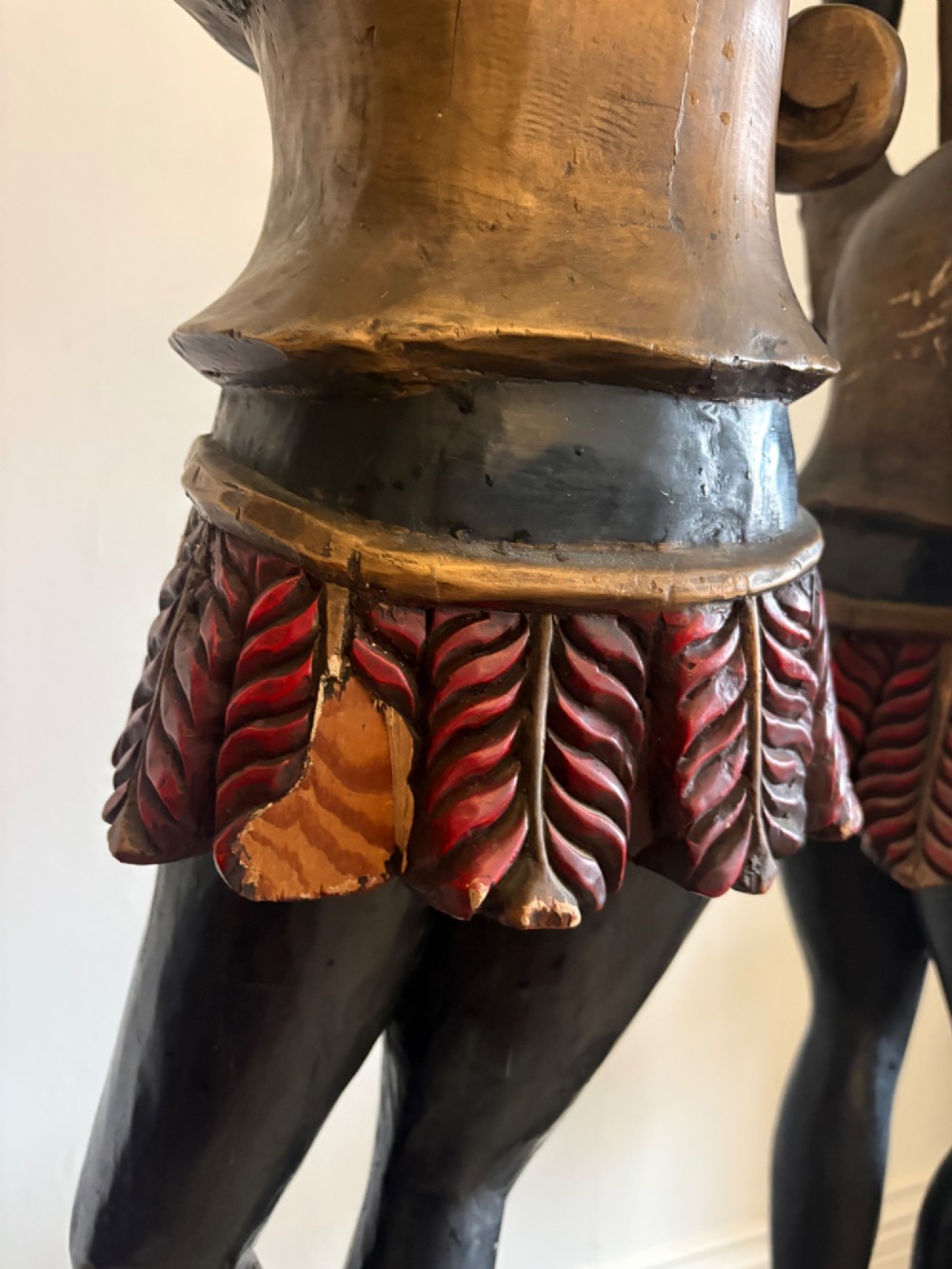 A pair of life-sized Venetian carved wood figure floor lamps featuring gilt and polychrome details, mounted on ornate pedestals with multi-light metal candelabra tops. View VI