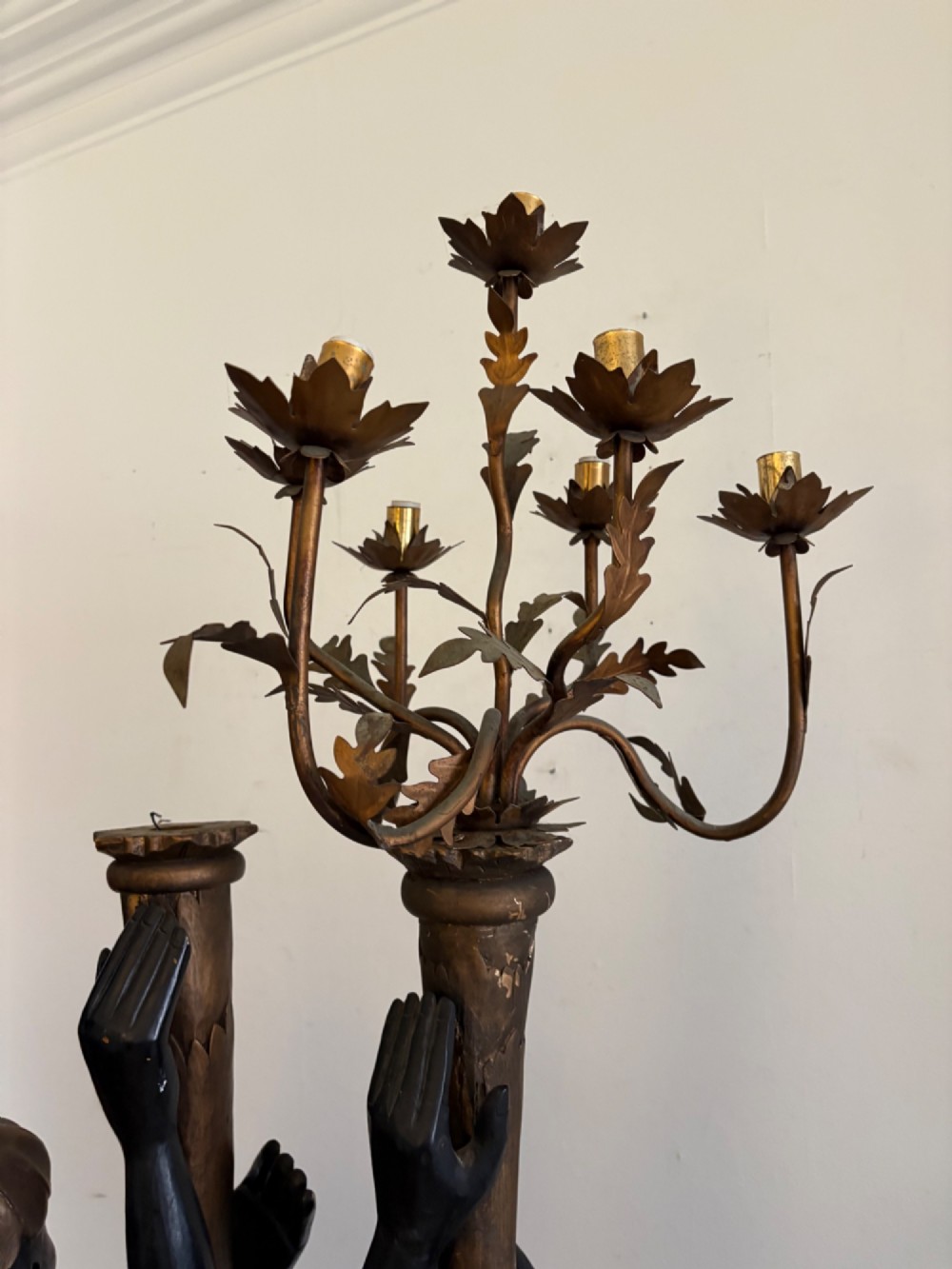A pair of life-sized Venetian carved wood figure floor lamps featuring gilt and polychrome details, mounted on ornate pedestals with multi-light metal candelabra tops. View VII