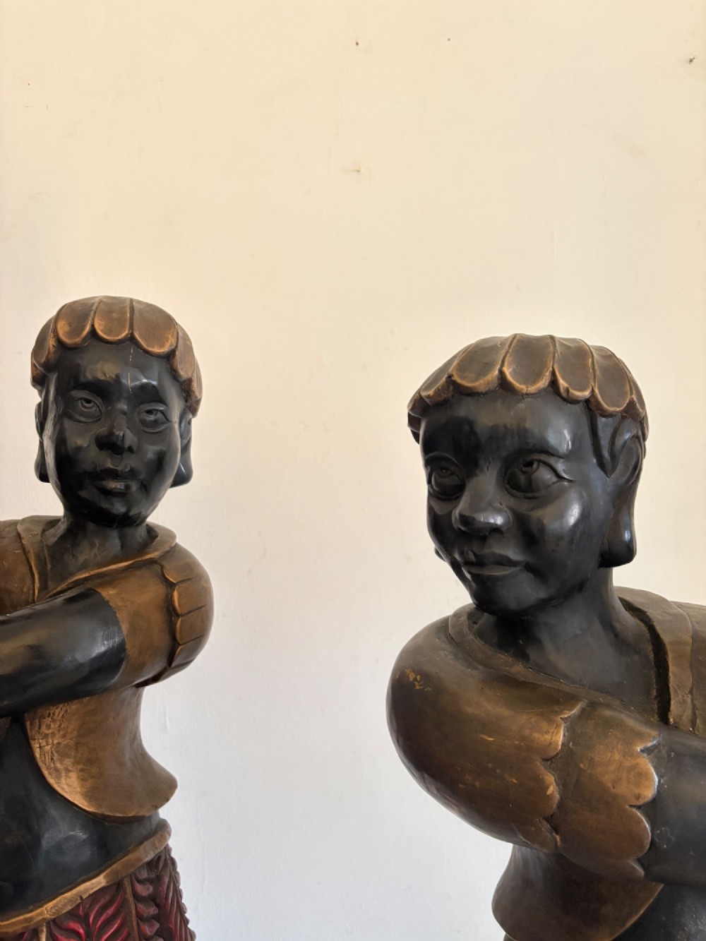 A pair of life-sized Venetian carved wood figure floor lamps featuring gilt and polychrome details, mounted on ornate pedestals with multi-light metal candelabra tops. View XIII