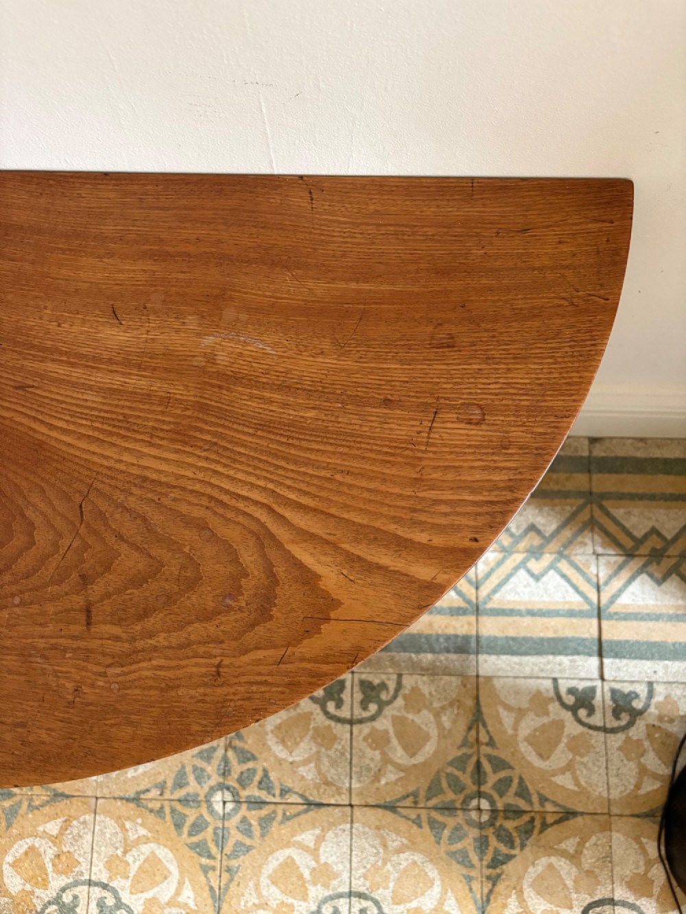 A late 18th-century George III semi-circular demi-lune folding table crafted from cherrywood and elm with four tapered square legs. View VIII