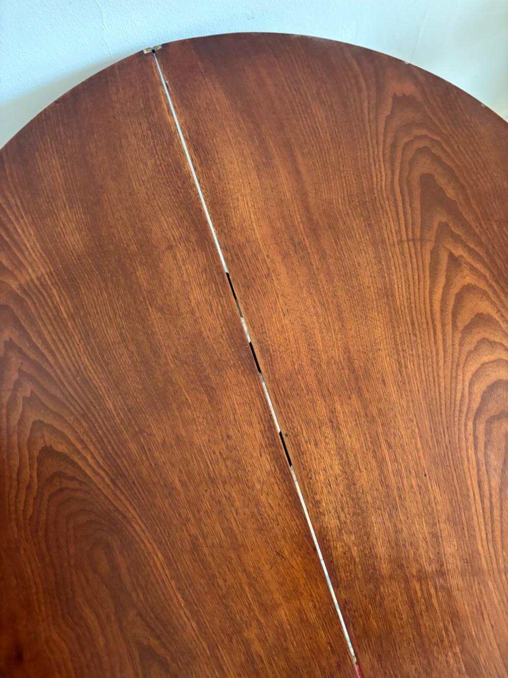 A late 18th-century George III semi-circular demi-lune folding table crafted from cherrywood and elm with four tapered square legs. View IX