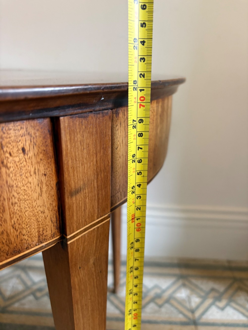 A late 18th-century George III semi-circular demi-lune folding table crafted from cherrywood and elm with four tapered square legs. View XIII