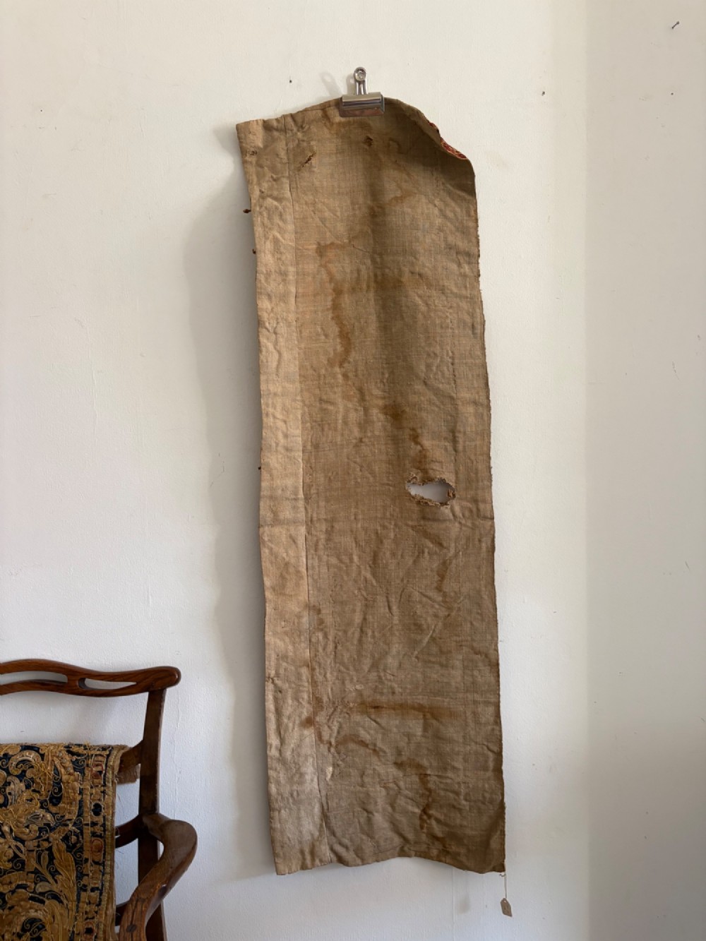 A long vertical 17th-century Italian crimson velvet textile fragment with gold silk acanthus leaf embroidery and patterned borders. View XI