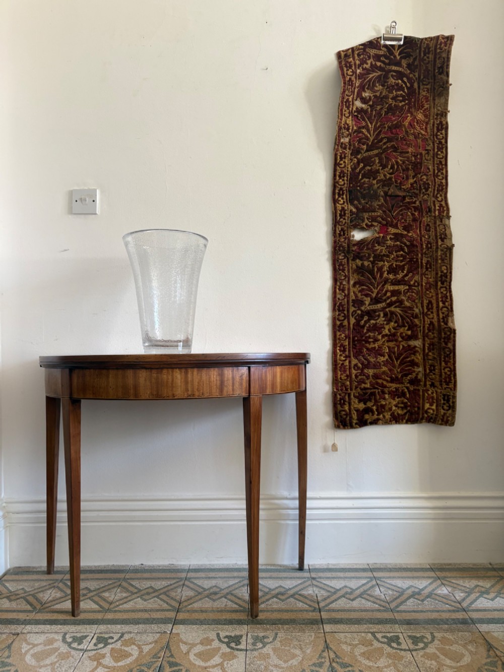 A long vertical 17th-century Italian crimson velvet textile fragment with gold silk acanthus leaf embroidery and patterned borders. View XIII