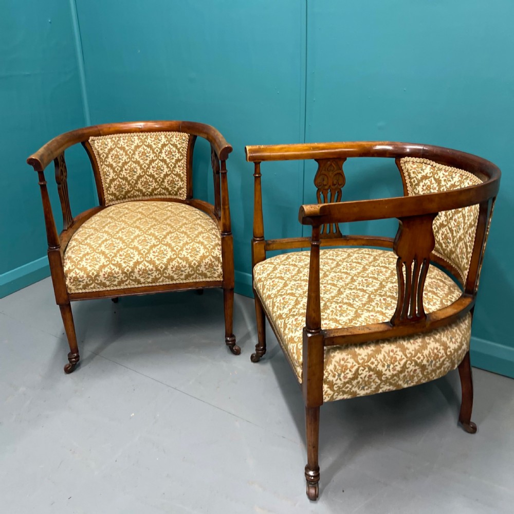 Pair of Edwardian mahogany tub armchairs on castors View II