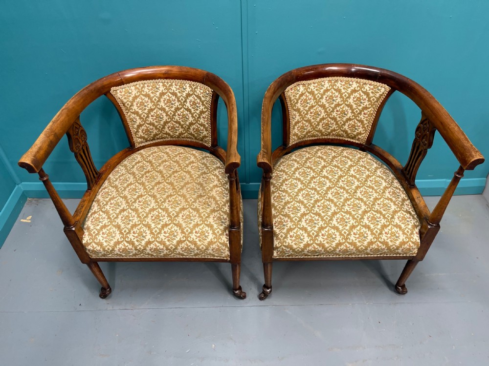 Pair of Edwardian mahogany tub armchairs on castors View X