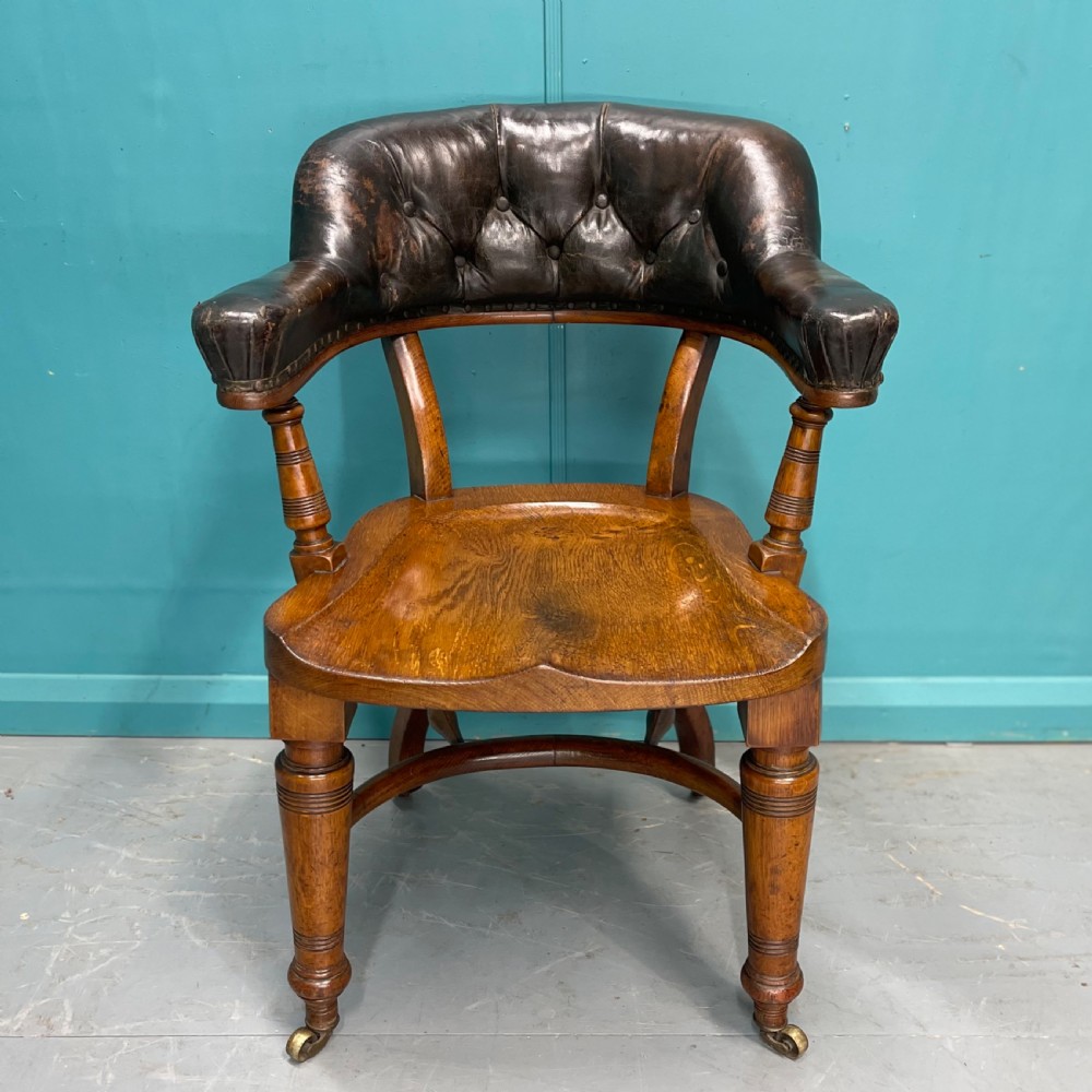 Victorian leather back desk chair with crinoline stretcher